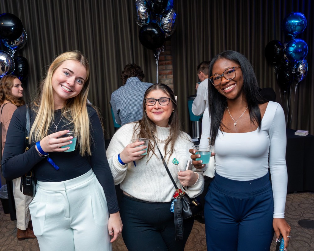 Girls wearing white pose together